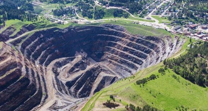 Open-pit mining in context and by example