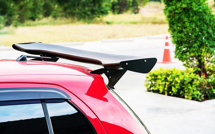 What is a car spoiler and how does it work?