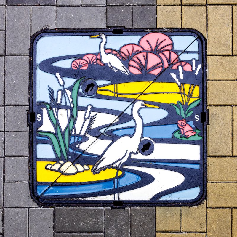 Turning manhole covers into creative canvases! Discover art beneath your feet on manhole covers scattered across the city, featuring iconic landmarks and mascots like the white egrets of Tsuen Nam Road, the Tree of Fortune of Lam Tsuen and Stilt Houses of Tai O.  Photo 1, 2, 4, 5: Hong Kong Tourism Board  Photo 3: Drainage Services Department  #hongkong #brandhongkong #asiasworldcity #artsandculture #manhole